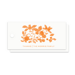 A stack of white paper gift tags with a circular hole on the left, featuring an orange floral and acorn illustration with the text 'THANKS | THE MORRIS FAMILY' printed below, shown on a plain white background.
