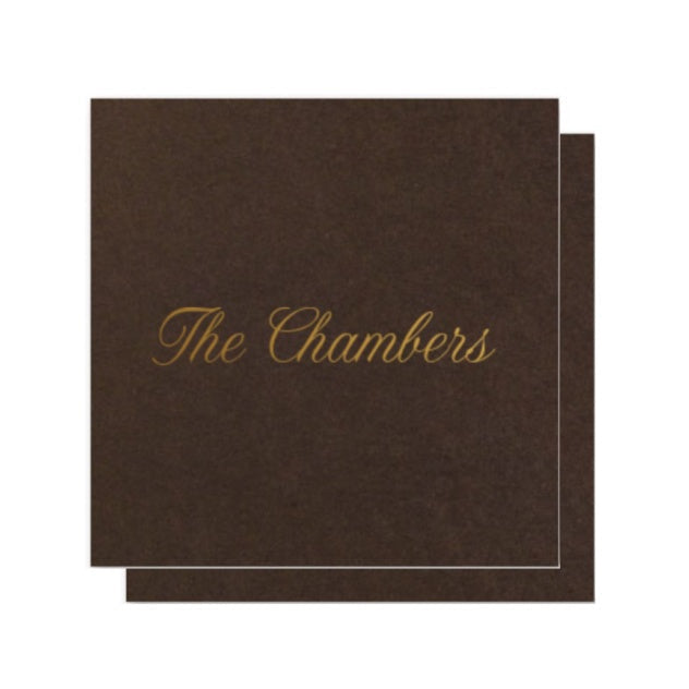 Brown enclosure card with 'The Chambers' gold text on a white background 