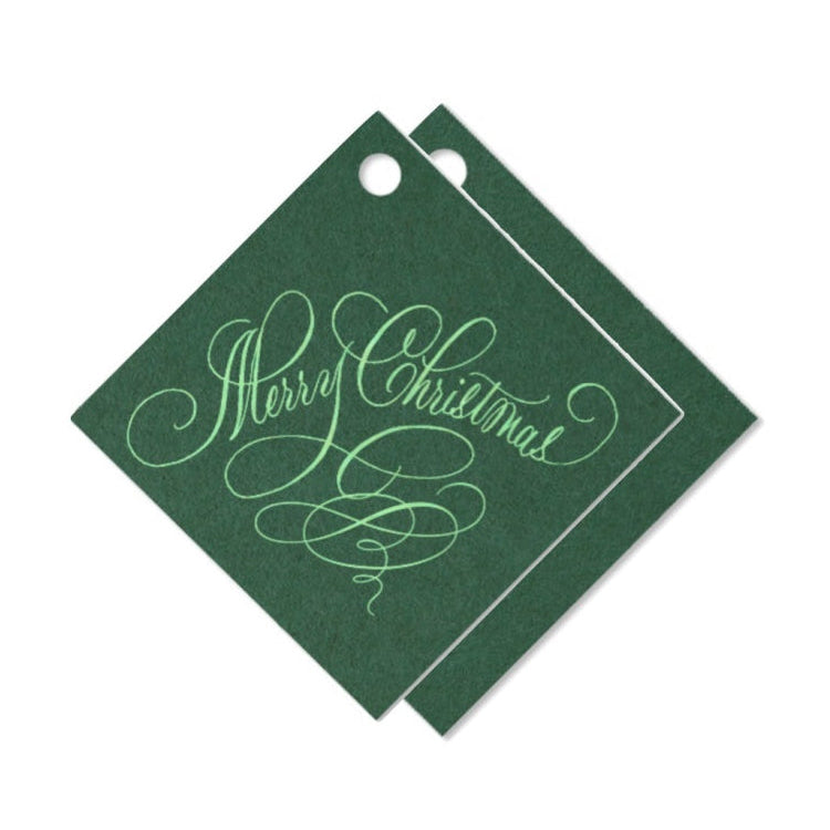 Two green gift tags with 'Merry Christmas' text on a white background