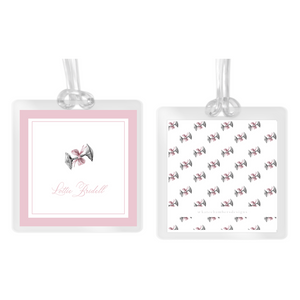 Girl's Watercolor Silver Rattle with Pink Bow Square Laminated Bag Tag